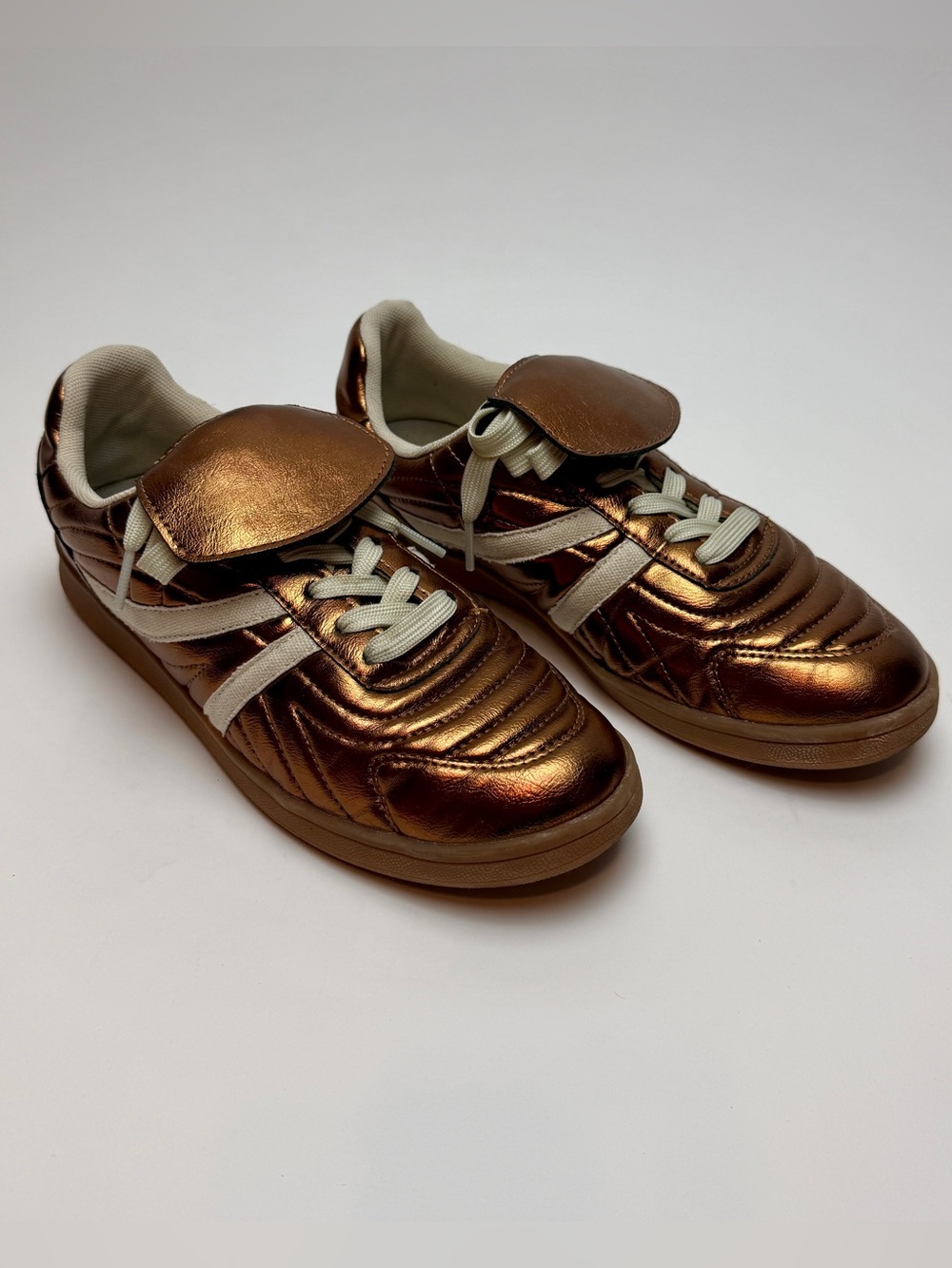 Steve Madden: Copper metallic sneakers